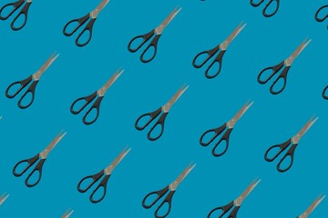 Background for the design and banner. Scissors on a blue background. Pattern.