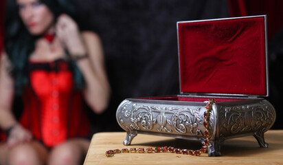 Jewelry Box with Woman in Corset in background, Shallow DOF, Focus on Jewelry Box