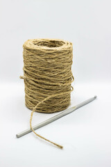 A skein of jute rope with a hook