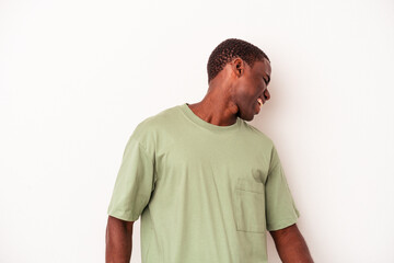 Young African American man isolated on white background dancing and having fun.