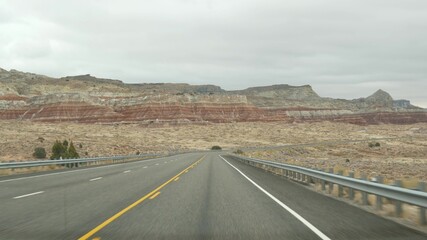 Road trip to Grand Canyon, Arizona USA, driving auto from Utah. Route 89. Hitchhiking traveling in America, local journey, wild west calm atmosphere of indian lands. Highway view thru car windshield.