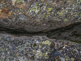 Dangerous fault in the granite rock. Fault line or fracture in the rock, erosion, a crack in the...