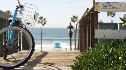 Blue bicycle, cruiser bike by ocean beach, pacific coast, Oceanside California USA. Summertime...