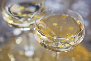 Glass of champagne with golden stars