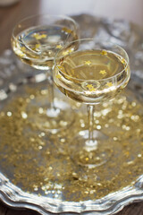 Glass of champagne with golden stars