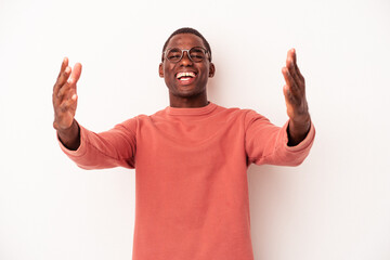 Young African American man isolated on white background celebrating a victory or success, he is surprised and shocked.