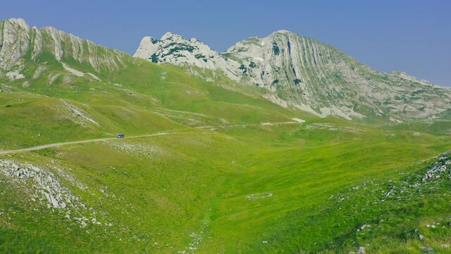 Beautiful couple traveling in Mountain Prutas at National Park Durmitor, Montenegro. Lifestyle and travel.