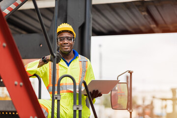 Portrait Black African staff worker happy smile working in cargo crane shipping logistic port.