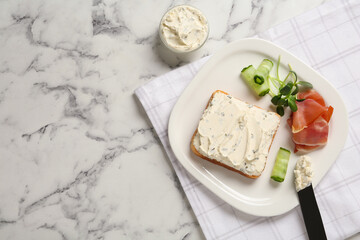 Delicious sandwich with cream cheese, cucumber and jamon on white marble table, flat lay. Space for text