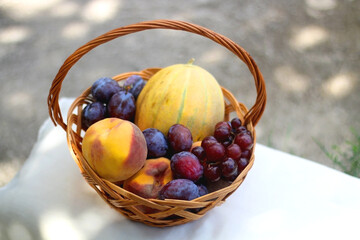 Vintage basket filled with various fruit. Selective focus.