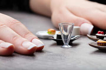 Fototapeta na wymiar female hands on a table with a mini meal