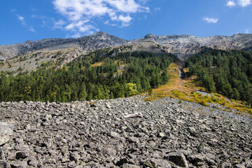landscape with scree at the bottom of the mountain - obrazy, fototapety, plakaty