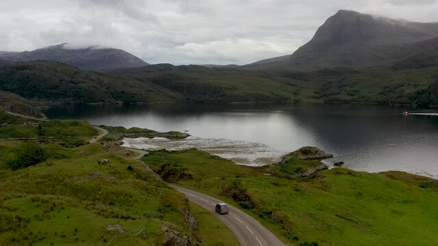Drone shot of winding road near the Kylesku Bridge in north-west Scotland that crosses the Loch a' Ch&agrave;irn Bh&agrave;in in Sutherland