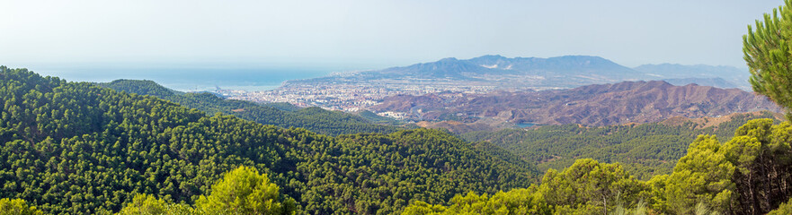 Fototapeta na wymiar Panoramic view on the city of Malaga and its airport valley, from Montes de Malaga natural park