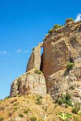 Fototapeta na wymiar Strangely shaped cliffs of Ronda, seen from below. (Malaga, Andalucia), Spain