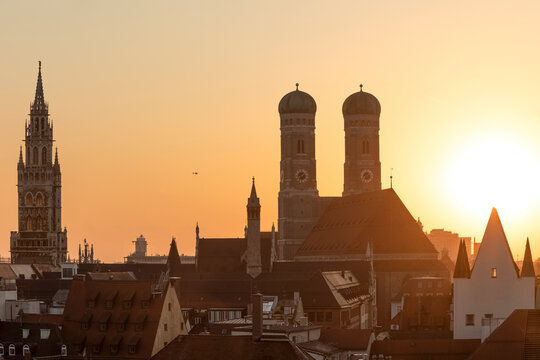 Germany, Bavaria, Munich, Helicopter view of Frauenkirche and surrounding old town buildings at sunset