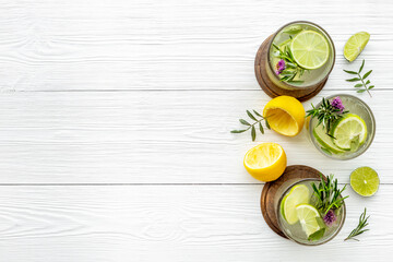 Fototapeta na wymiar Homemade herbal soda drink with lemon slices and herbs