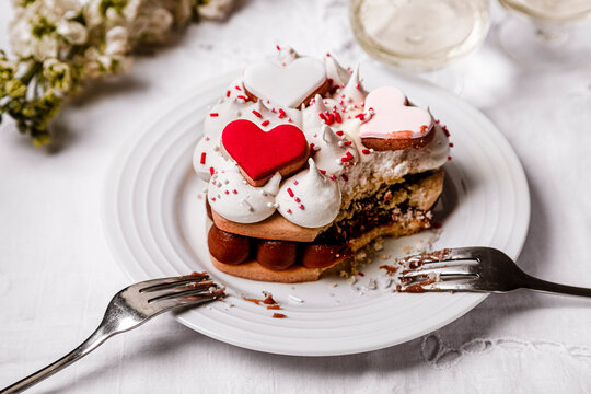 Plate with heart shaped cookie cake missing single bite
