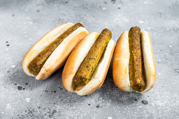Vegan hot dog with meatless Vegetarian sausage. Gray background. Top view