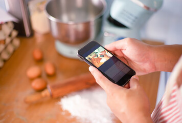 An image workshop blogger baking food from mobile on the social for take photo and home kitchen.