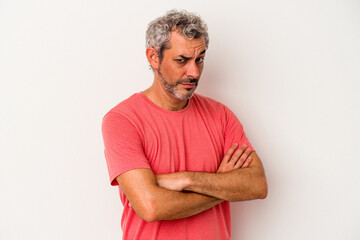 Middle age caucasian man isolated on white background  suspicious, uncertain, examining you.