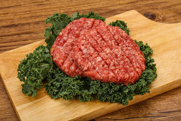 Raw beef burger cutlet for cooking