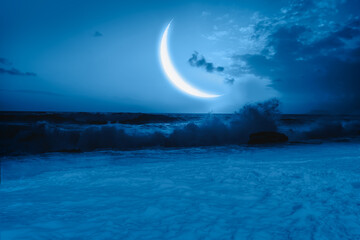 Crescent moon over the sea with lot of stars and nebula at night "Elements of this image furnished by NASA