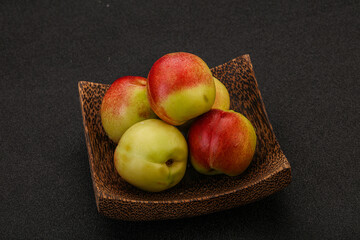 Sweet small nectarines in the basket