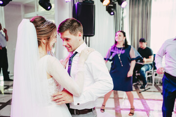 The groom looks at the bride