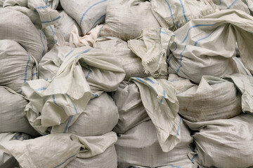 white bags with construction debris. Flood barrier