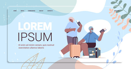 elderly couple of tourists grandparents with luggage holding passports and tickets ready to boarding at airport