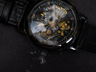 Close up shot of broken black wristwatch