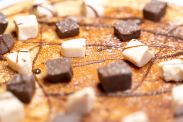 Dark and white chocolate shavings on top of a pancake
