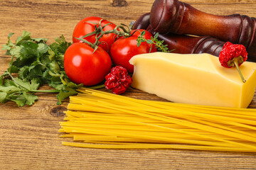 Raw Italian spaghetti heap with cheese