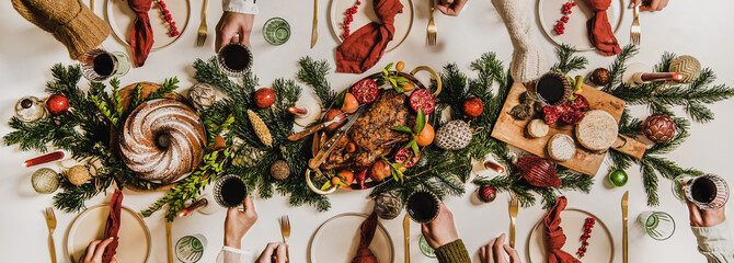 Flat-lay of Festive Christmas table setting and celebrating people hands - 459451083