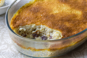 Rice pudding dessert baked with raisins and cinnamon close up