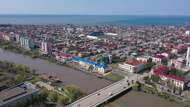 Scenic view from drone of Georgian port city of Poti located at entrance of Rioni river into Black Sea on sunny spring day, Samegrelo-Zemo Svaneti region. High quality 4k footage