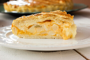 Brazilian Chicken Pie -  Homemade Chicken Pie on Spatula on a Wooden Table Rustic Appeal