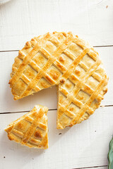 Brazilian Chicken Pie -  Homemade Chicken Pie on Spatula on a Wooden Table Rustic Appeal