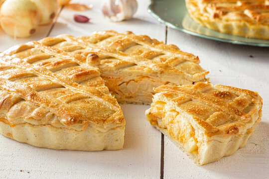 Brazilian Chicken Pie -  Homemade Chicken Pie on Spatula on a Wooden Table Rustic Appeal