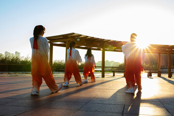 A group performs tai Chi, a Chinese martial art