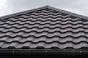 Dark brown metal roofing shingles