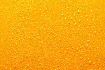 Water drops on metal, yellow background. May used as background