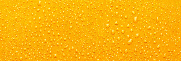 Water drops on metal, yellow background. May used as background