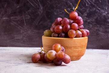 fresh grapes on concrete background