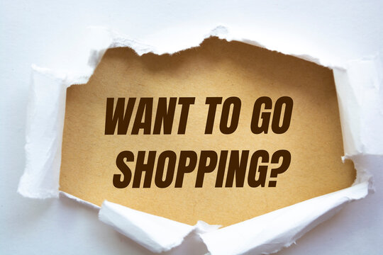 "Want to go shopping?" word written under torn paper.