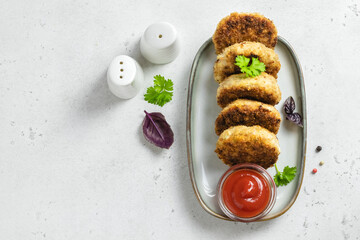 Turkey rissoles with ketchup. Space for text, top view.