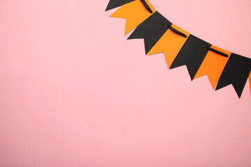 Blank and orange party flags for Halloween decoration on pink background
