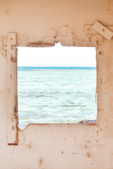 View of the red Sea from a white window in the wall, Hurghada, Egypt
