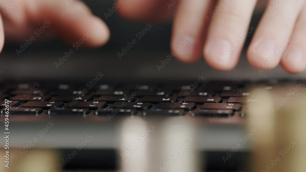 Poster the trader's hands are typing on the keyboard against the background of stacks of coins. the concept